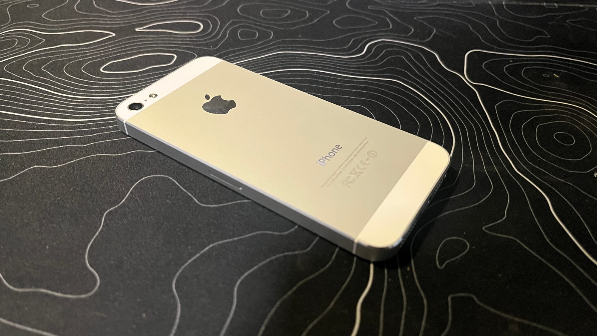 The back view of my iPhone 5, showing its silveriness.