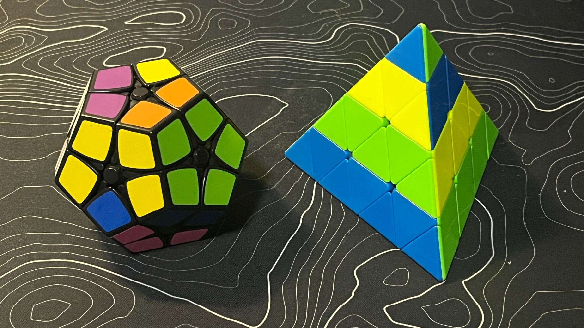A Shengshou Kilominx and stickerless QiYi Master Pyraminx.